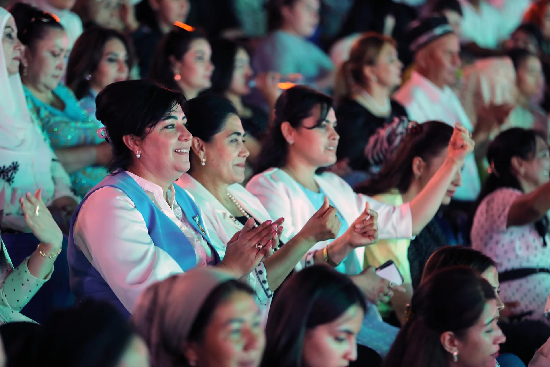 People clapping in an audience