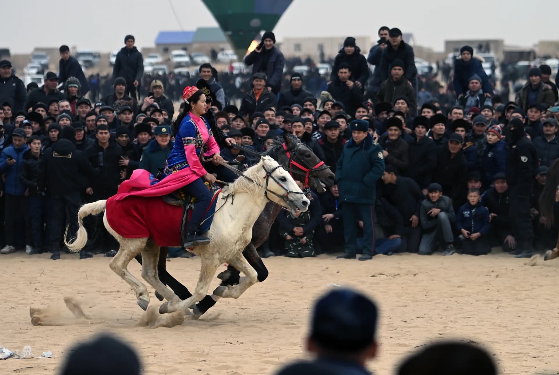 People riding horses outdoors