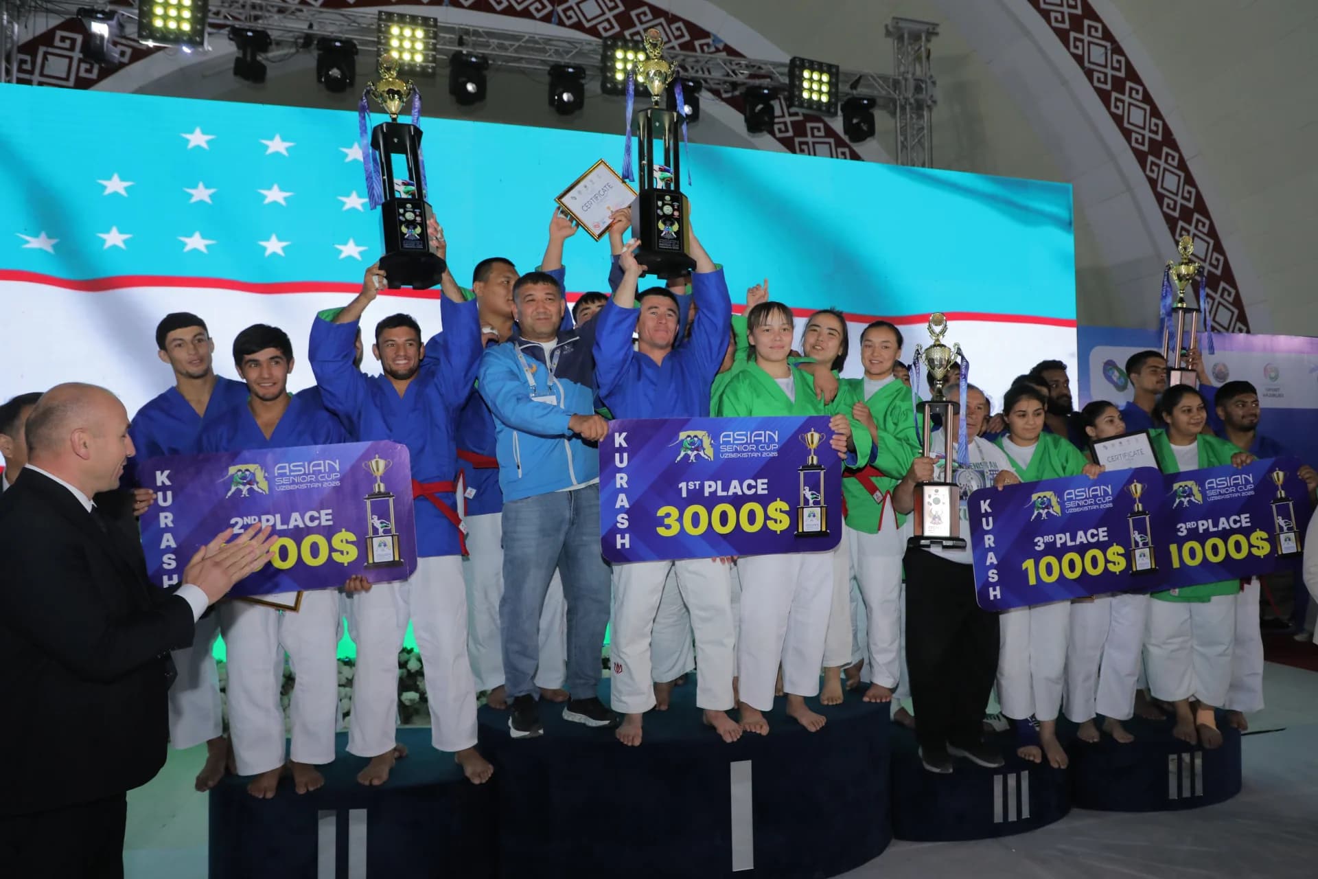 Athletes celebrating victory on a podium with trophies
