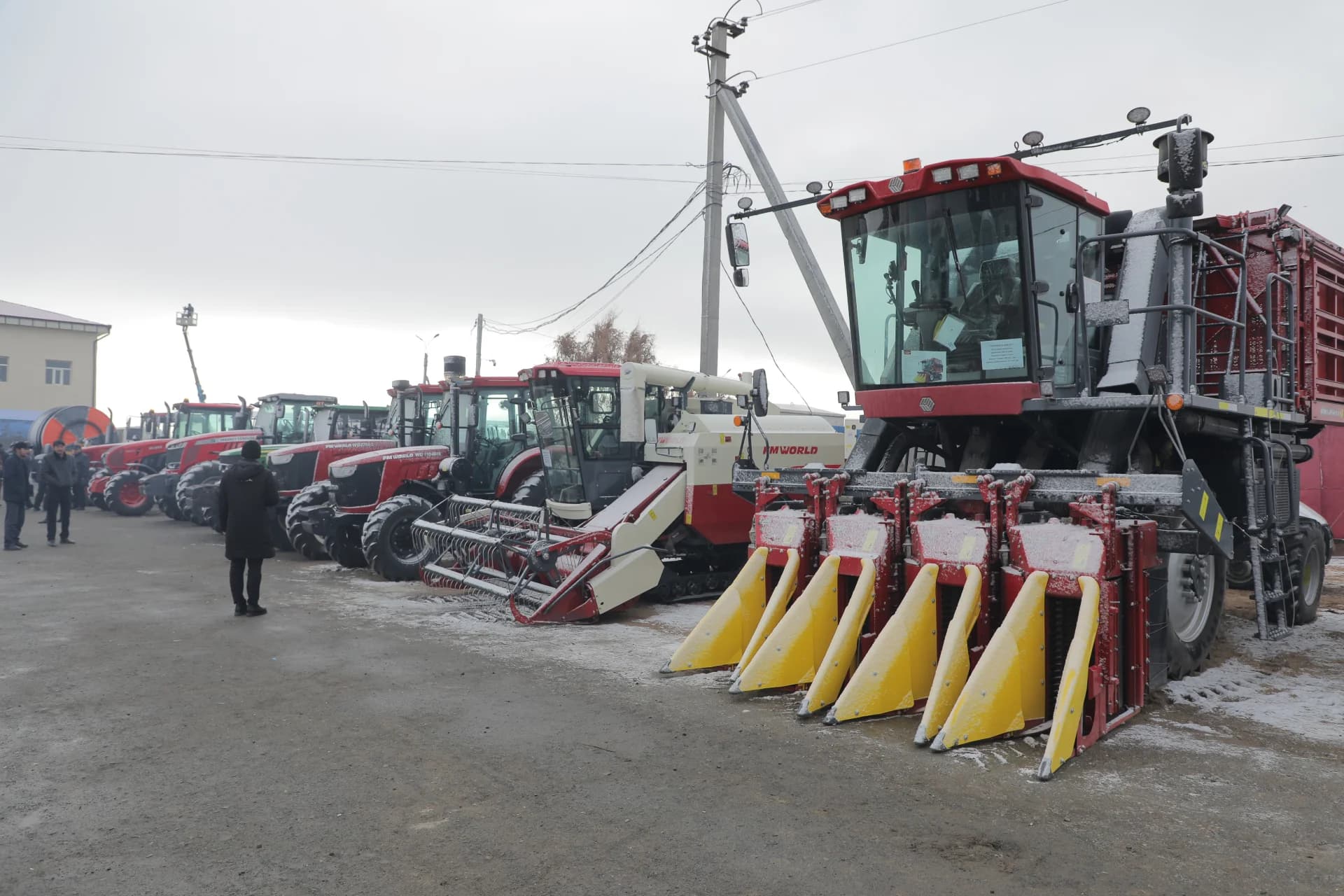 Agricultural machinery parked outdoors in winter