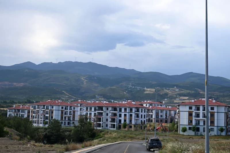 Modern residential complex near mountain range