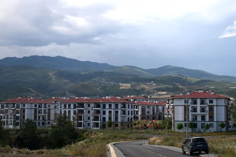 Modern residential complex near mountain range