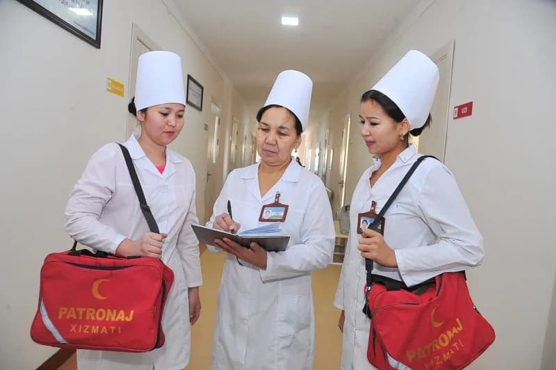 medical workers reviewing patient records