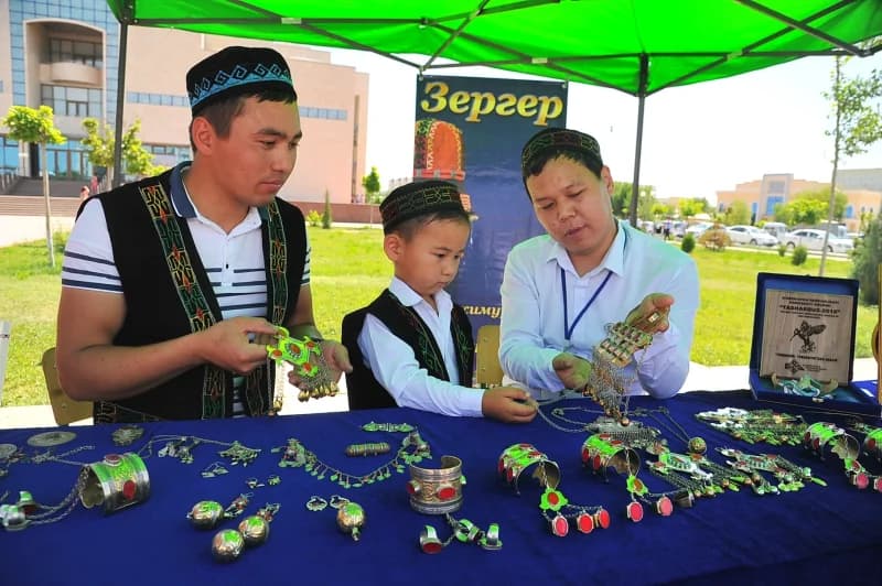 Craftsmen display traditional metal jewelry
