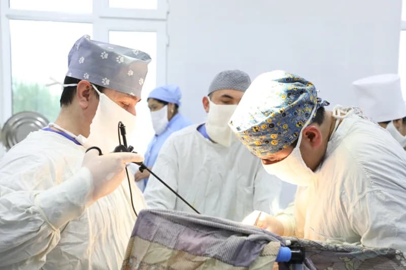 Surgeons performing operation in hospital