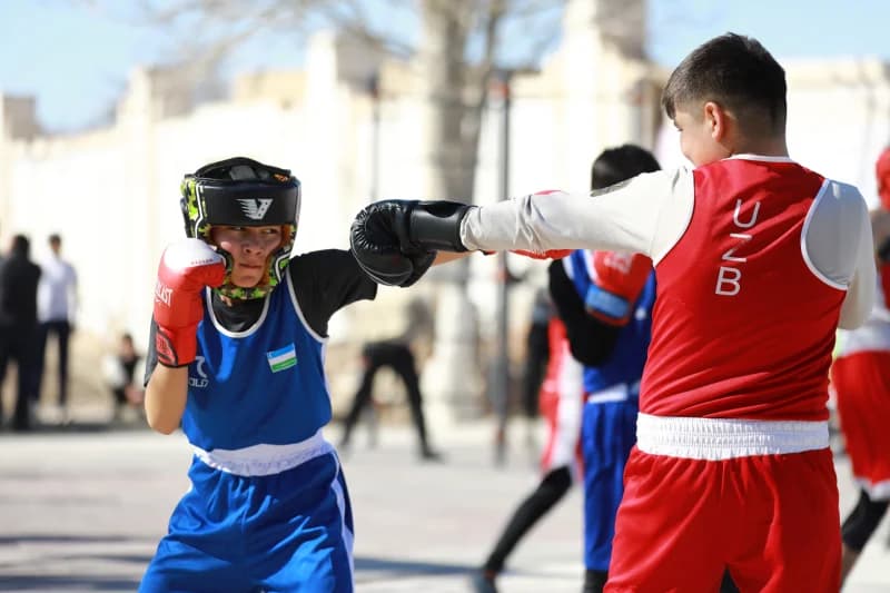 Young athletes sparring in boxing match