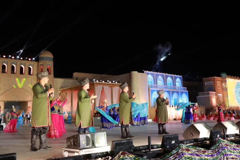Performers dancing on outdoor stage