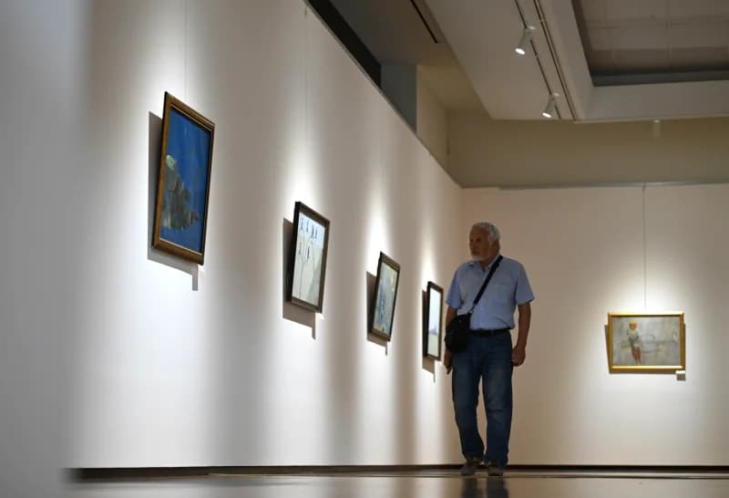 Man walking through art gallery