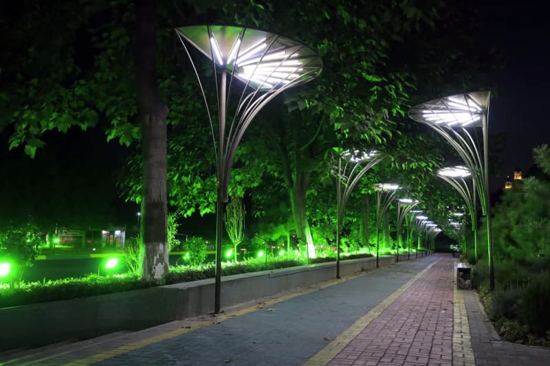 Illuminated pathway with modern decorative streetlamps