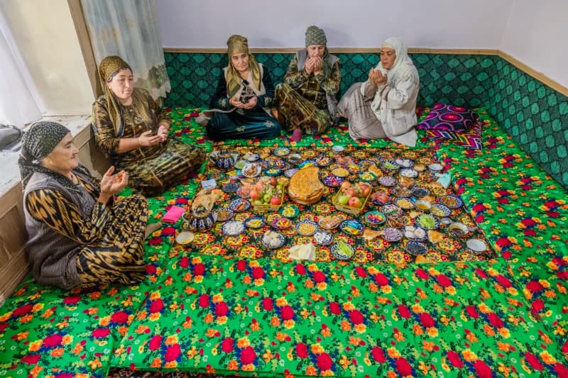 Women sitting around food spread