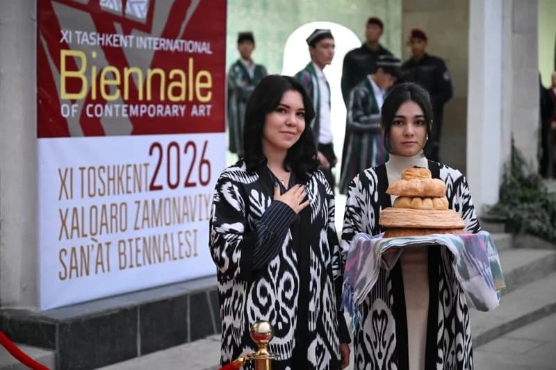 People posing with traditional bread at an exhibition